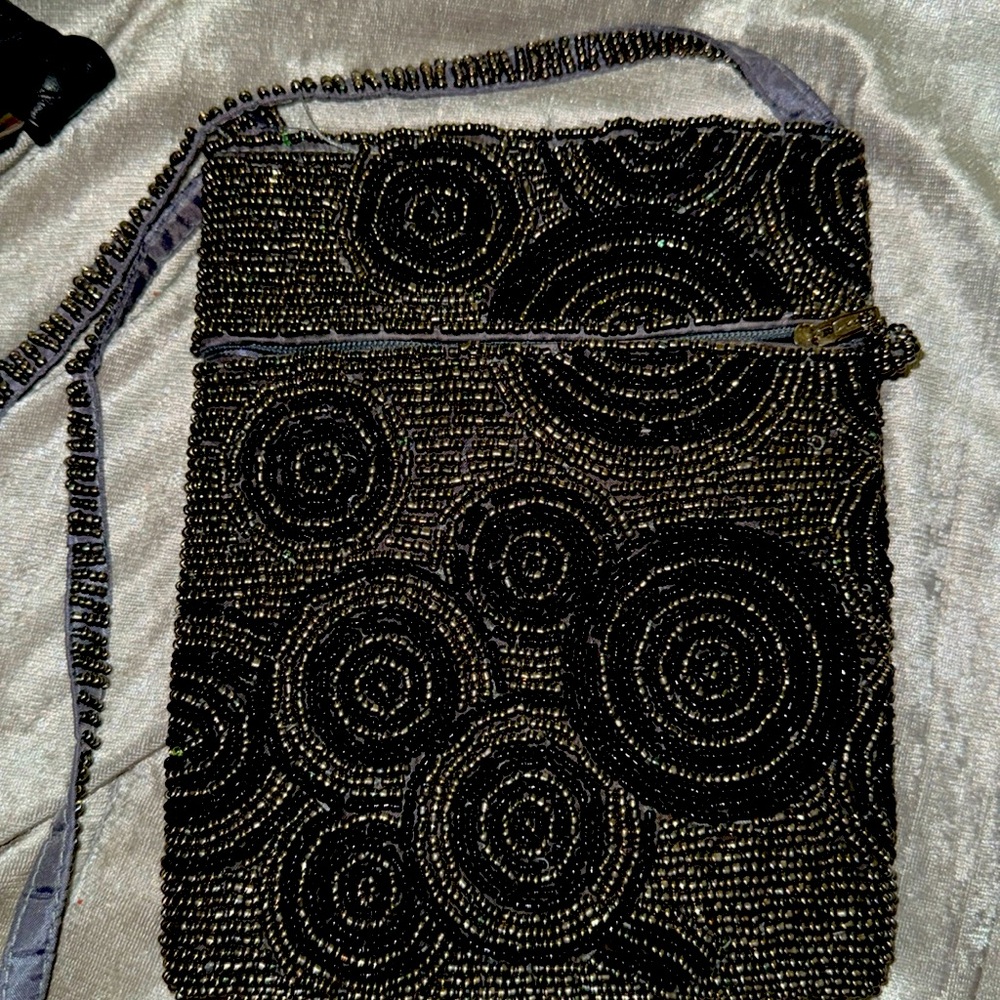 + Gold and silver in color Beaded crossbody.
